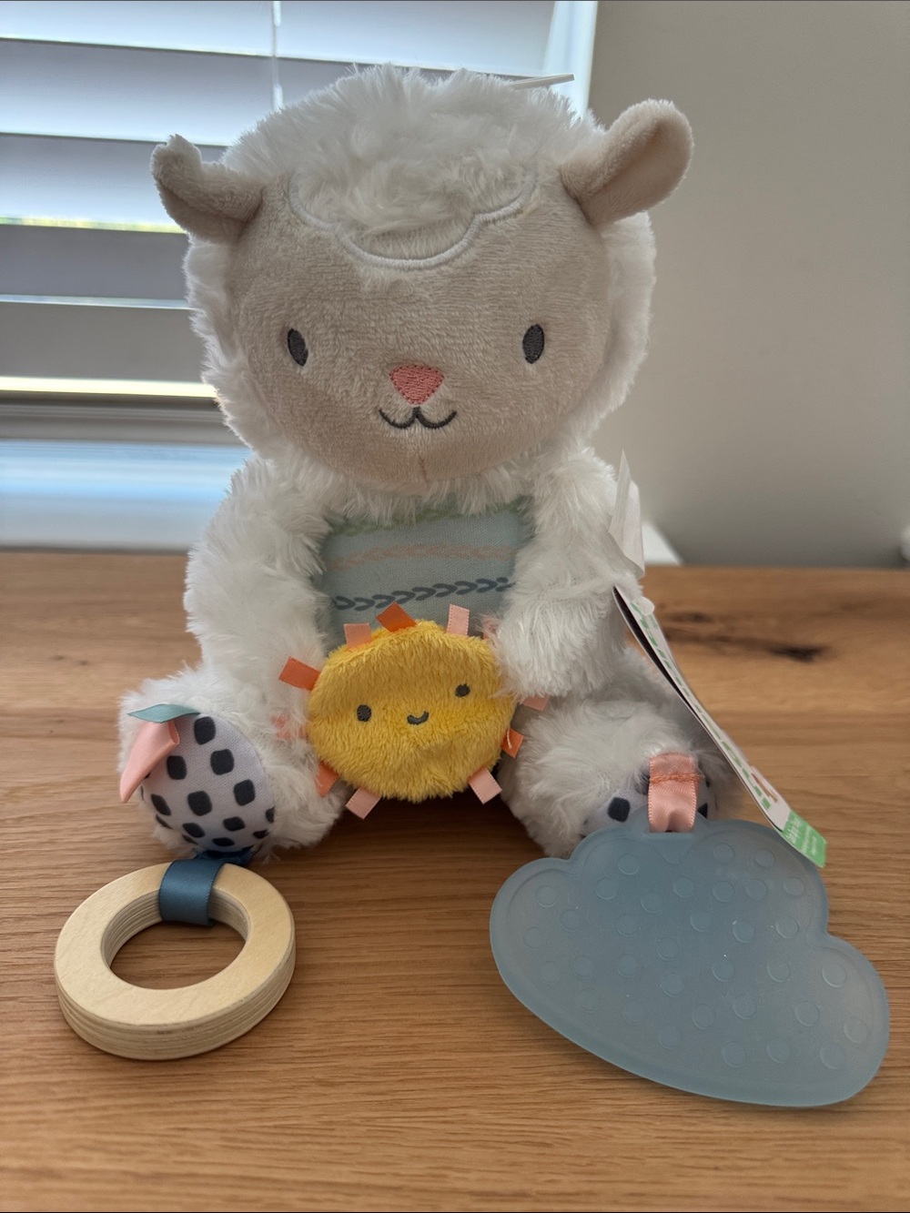 Plush White Lamb Sensory Toy with Yellow Sun Rattle and Blue Teether